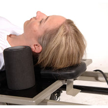 Black head and neck support pillow supporting head and neck during use