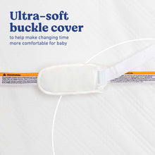 Contoured water-resistant changing pad with padded buckle cover
