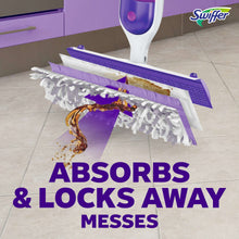 Power mop head with purple side flaps and striped pad over smeared mess