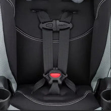 Booster seat harness straps and red buckle detail on black padding