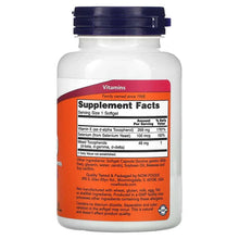Vitamin E softgels supplement facts label on plastic bottle with blue cap
