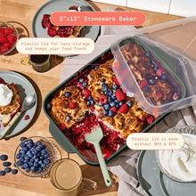 Green stoneware baker with berry dessert and clear plastic lid