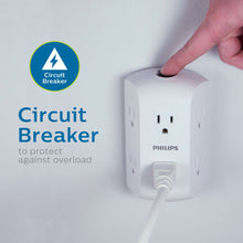 White wall outlet tap with side-access circuit breaker and a plug inserted