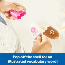 Children holding alphabet letter pop toys; A and G letters are visible
