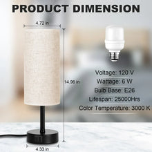 Table lamp with linen drum shade and black base; bulb shown