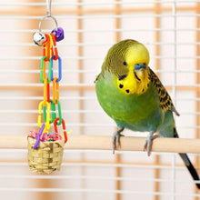 Bird shredding toy with colorful chain links, bell topper, and woven basket for parrots