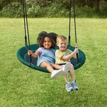 Green outdoor saucer swing with woven seat and two hanging ropes