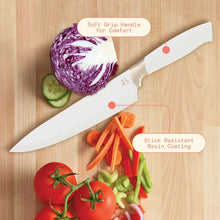 White chef knife with soft-grip handle cutting vegetables on a wooden cutting board