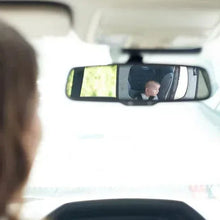 Backseat baby mirror on headrest display, showing baby through wide reflective lens