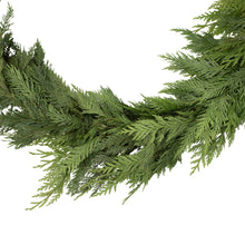 Evergreen cedar garland strand with overlapping pine-like branches and layered texture