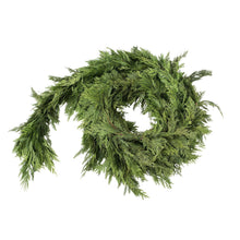 Evergreen cedar garland wreath with full circular wrap of pine-like branches and ties
