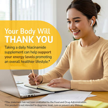 Niacinamide supplement lifestyle banner with smiling woman writing at a laptop.