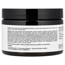 Black hair masque jar with ingredient and directions label on the back