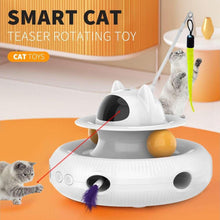 White rotating smart cat teaser toy with black sensor top and feather wand