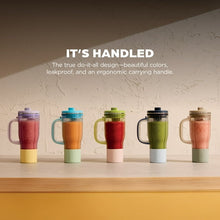 Assorted color personal blender travel cups with leakproof lids and ergonomic carrying handles.