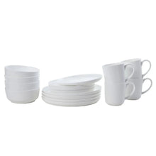 White bone china set with stacked bowls, saucers, and two handle mugs.