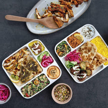 Divided white picnic food tray with assorted sides and mini condiment cups