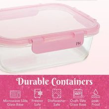 Clear glass food storage container with pink snap-on lid, close-up