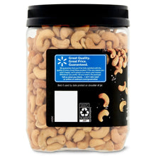 Whole cashew jar with black lid, showing cashews and a back label panel