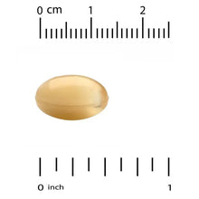 Biotin softgel capsule next to ruler, 0 to 1 inch scale