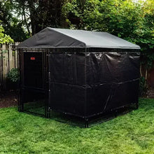 Black metal dog kennel with covered roof and wire privacy screen
