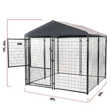 Large black metal dog kennel with privacy screen and hinged front door