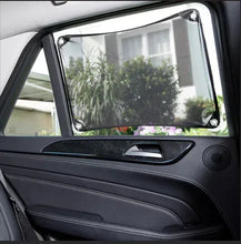 Car door window shade installed over rear side window with suction corners