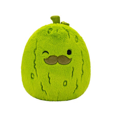 Green pickle-shaped plush toy with fuzzy texture and small mustache