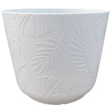 Large round white resin planter with embossed leaf pattern texture