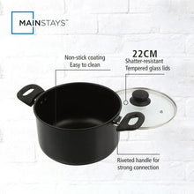 Black Dutch oven with non-stick interior, glass lid, and riveted side handles