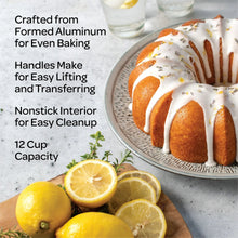Bundt cake pan with side handles, shown with sliced bundt cake