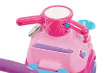 Pink ride-on car top console with handle and blue control wheel detail