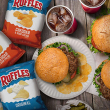 Potato snack chips with burgers and toppings on a plate