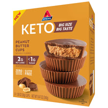Atkins Keto peanut butter cups box, side view showing dark chocolate cup and filling