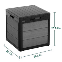 Grey resin deck storage box with front latch, shown with size measurements in inches