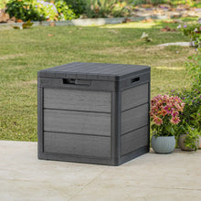 Grey resin deck storage box with textured slatted lid and front panel, closed