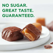 Sugar-free caramel-filled chocolates in dark coating, two pieces on a plate