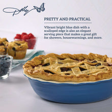 Blue ceramic pie dish holding a lattice-topped pie with golden crust