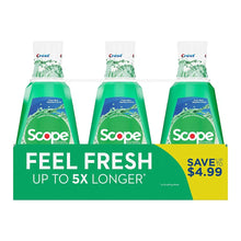 Three mint green Scope mouthwash bottles with white caps and front labels
