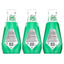 Three mint green Scope mouthwash bottles showing back labels, white caps