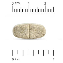 Plant sterols supplement tablet, beige, shown with measurement scale