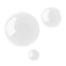 Liquid hair and scalp oil droplets in white pool, glossy clear texture
