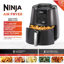 Black 4-qt air fryer with pull-out basket and control screen, shown with food