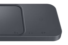 Wireless charging dock close-up of dark base with pad contacts and indicator dots