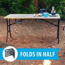 Gray folding rectangle table outdoors with black legs, with center hinge area visible.