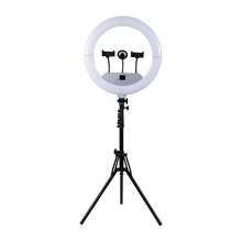 Ring light with tripod stand and three phone-holder clips at the top
