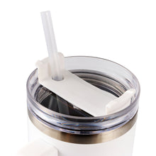 Stainless steel tumbler lid with clear straw and ring seal on white cup