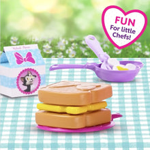 Purple serving pan and stacked pretend food pieces with Minnie Mouse bucket accessories