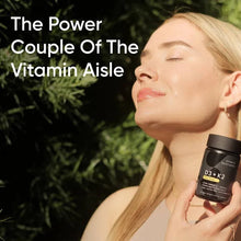 Woman holding a Sports Research D3 + K2 veggie softgels bottle
