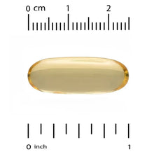 Omega-3 fish oil softgel, amber gel capsule shown with measurement scale
